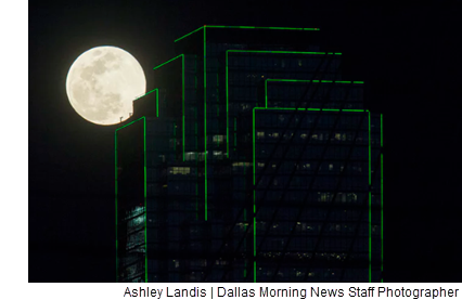 A full "worm" moon supermoon rises near the Bank of America building on March 20 in downtown Dallas.  (Ashley Landis/Staff Photographer