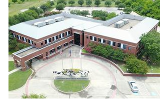 An aerial view of the former home of the American Paint Horse Association, which was purchased by Mid-States Dsitribution Co. who plans to move their hq there from Minneapolis.