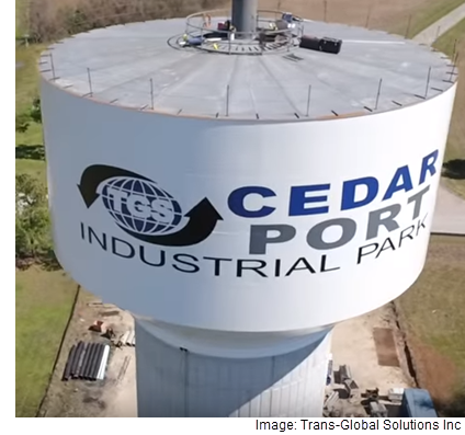 A water tower that has the Cedar Port Industrial Park logo on it.