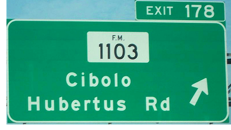 An image of a road sign that reads "Exit 178, FM 1103, Cibolo, Hubertus Rd., 1/2 mile". The sign is situated along I-35.