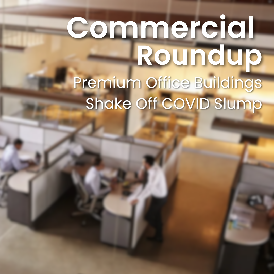 Cover for "Commercial Roundup: Premium Office Buildings Shake Off COVID Slump" with a background of an out-of-focus office space with cubicles and staff.